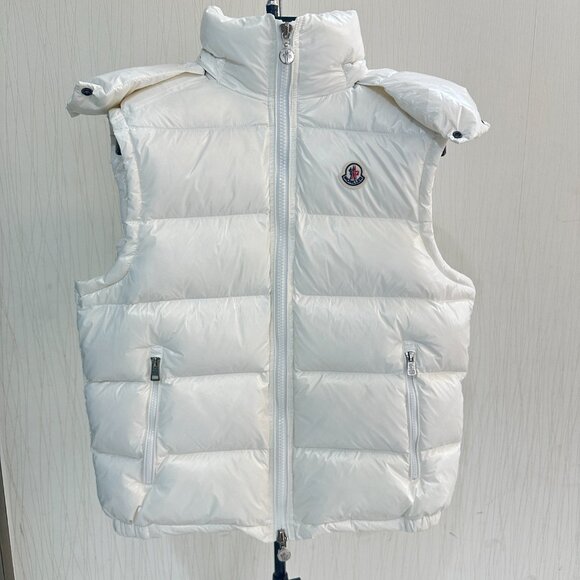 This Moncler white down vest features a mini-puffy design, offering warmth and c - Picture 1 of 8